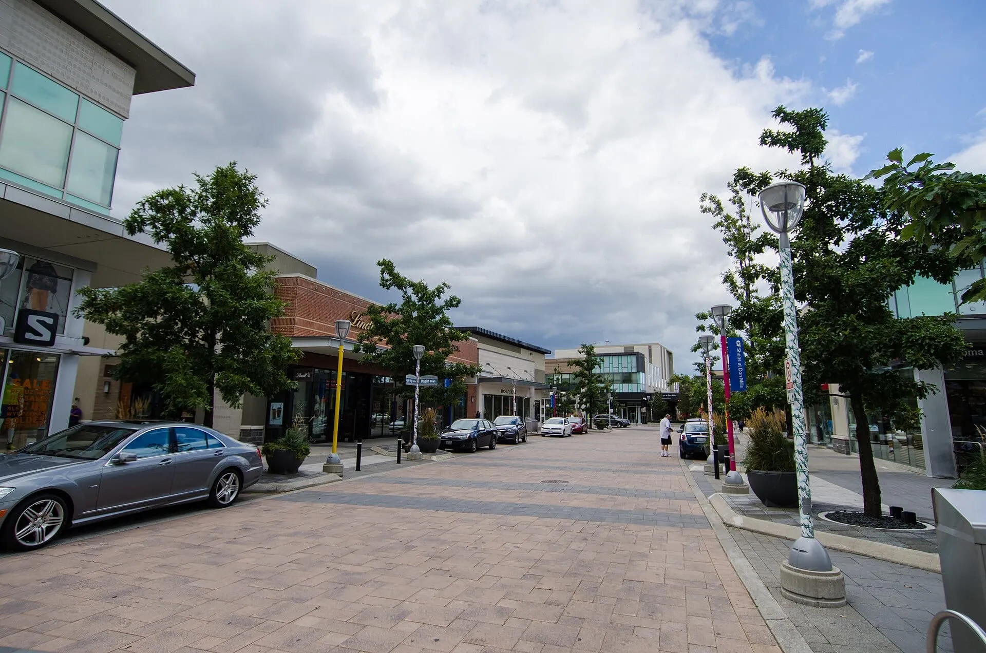 A tree-lined pedestrian street at the Shops at Don Mills in Don Mills, Toronto.