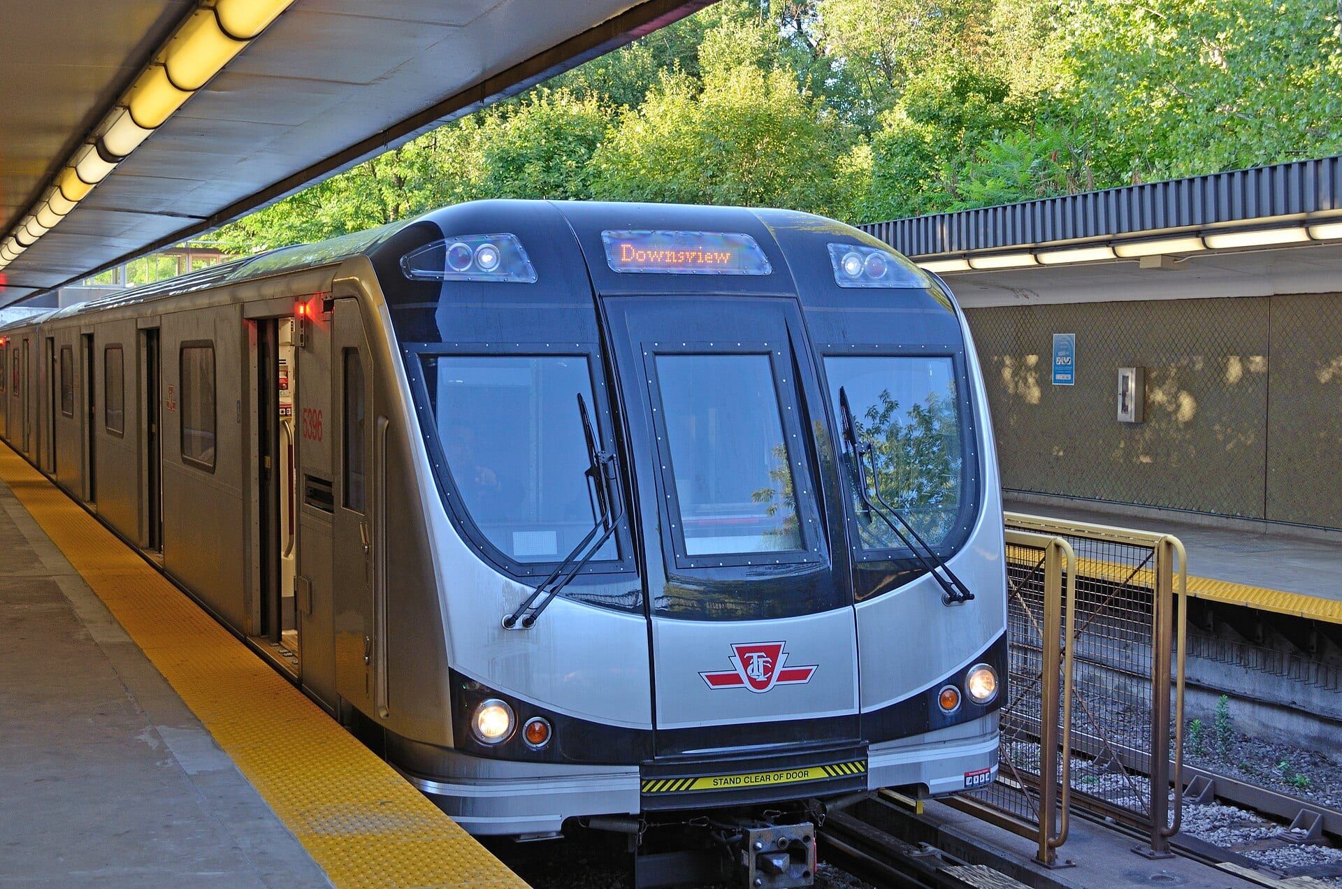 A Toronto Rocket subway train on TTC Line 1 at Rosedale station.